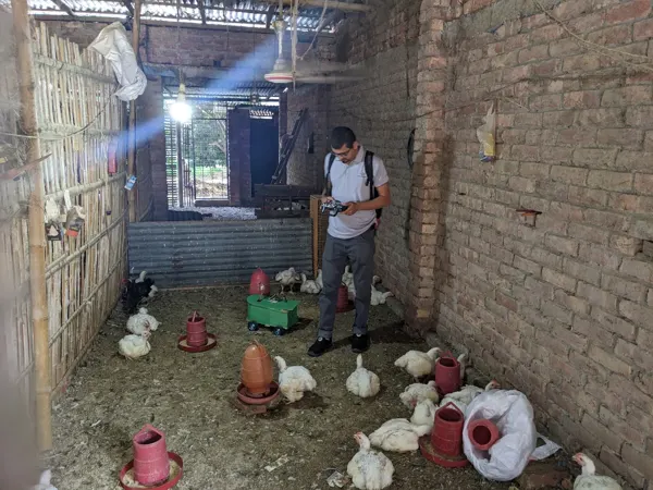 Working with an early prototype in a poultry shed.