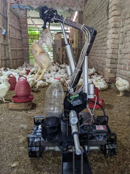 A front view of an earlier poultry-robot prototype in the shed.