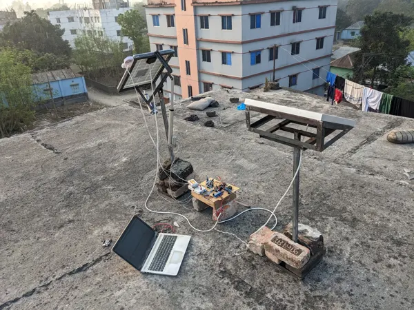 The rooftop comparison setup with a laptop for working with recorded data.