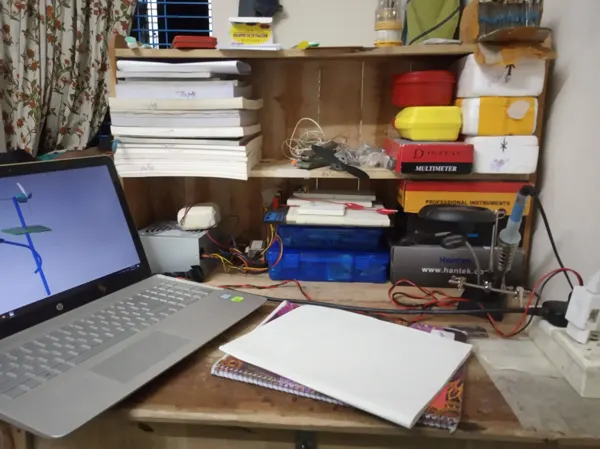 A small desk becoming a working space for electronics.