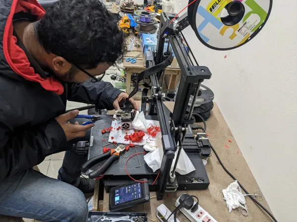 Hands-on fabrication work at the laboratory bench.