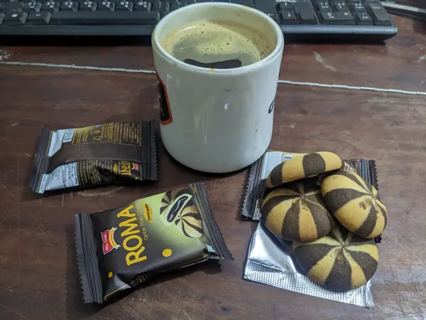 Coffee and biscuits beside the workbench.