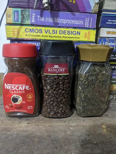 Coffee supplies beside the engineering books.
