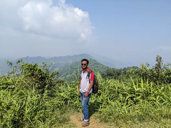 A walk through a green hillside landscape.