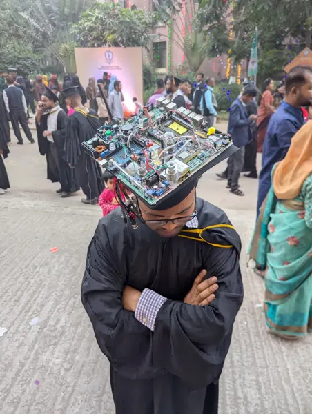 Retired and burned-out electronic components arranged on the graduation cap.