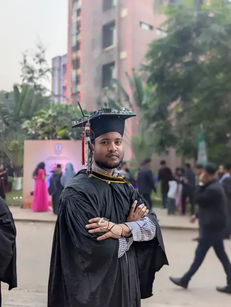 Portrait with the commemorative electronics graduation cap.