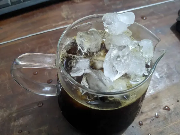 An iced-coffee experiment at the workbench.