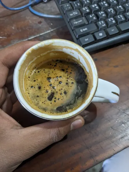 Coffee photographed during an ordinary workbench break.