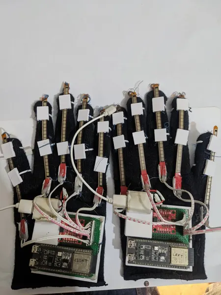 Earlier paired data-glove prototypes. This is not labelled as the final M.Sc. configuration.