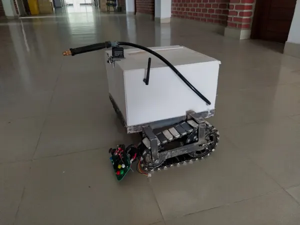 Earlier enclosed mobile-base prototype with tracked locomotion.